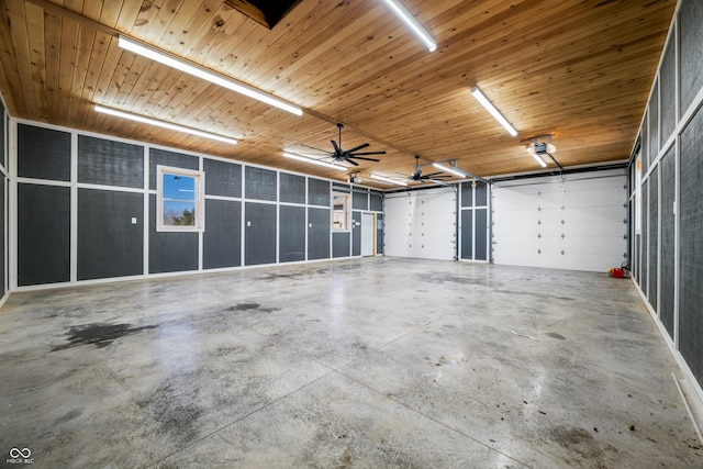 garage featuring wooden ceiling and a garage door opener