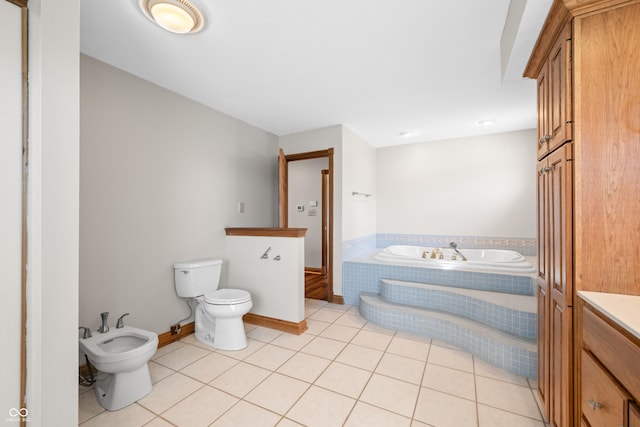 full bathroom with tile patterned flooring, a bidet, a garden tub, and toilet