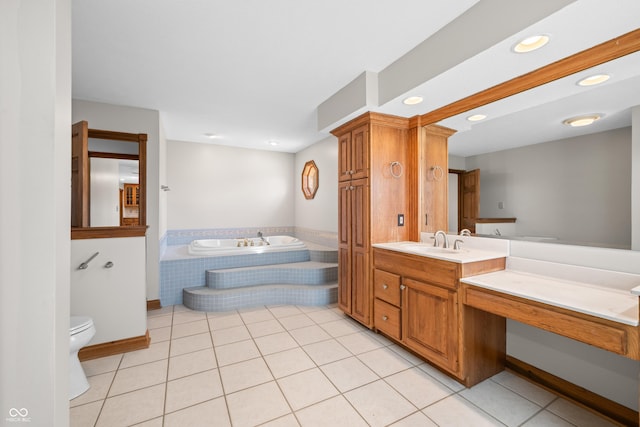 bathroom featuring a garden tub, recessed lighting, toilet, vanity, and tile patterned flooring