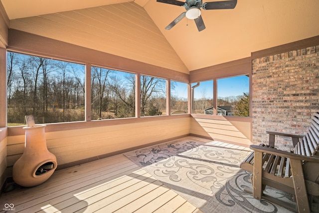 sunroom / solarium featuring vaulted ceiling and a ceiling fan