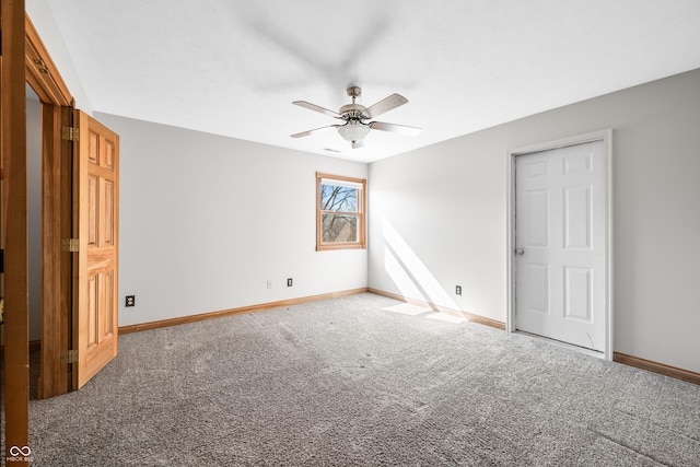 unfurnished bedroom with carpet flooring, ceiling fan, and baseboards