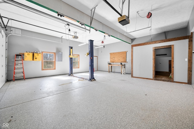 garage featuring electric panel and a garage door opener