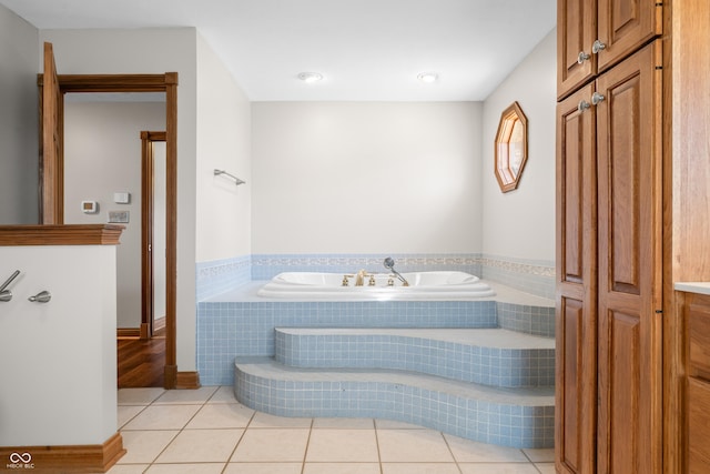 bathroom featuring a bath and tile patterned floors