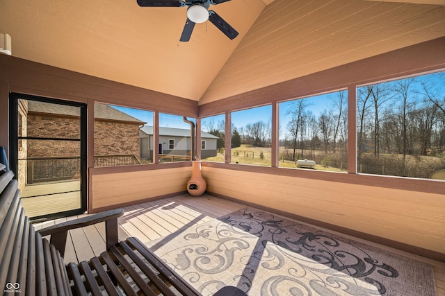 unfurnished sunroom with lofted ceiling