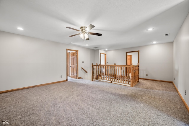 unfurnished room featuring baseboards, visible vents, ceiling fan, carpet floors, and recessed lighting