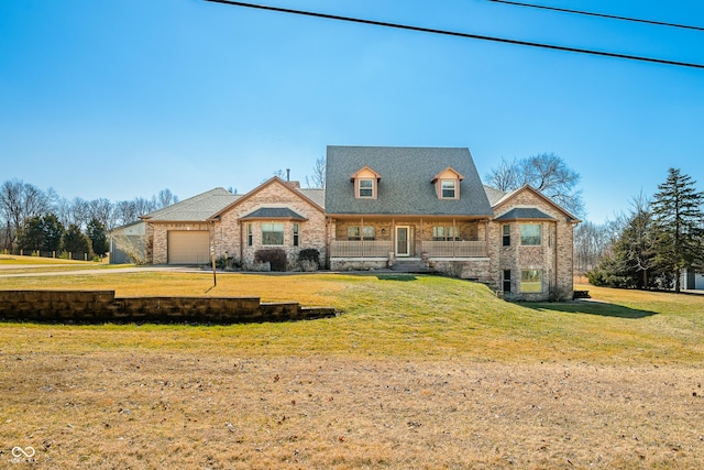 view of front facade with a garage, stone siding, and a front lawn