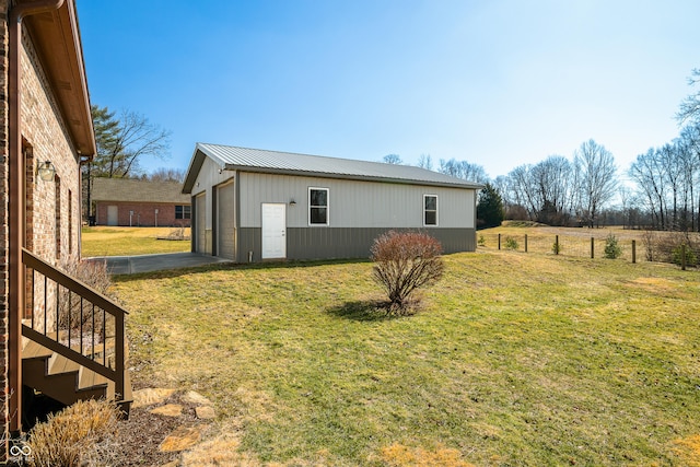 exterior space featuring a garage and an outdoor structure