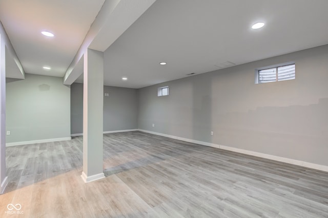 basement with light wood finished floors, baseboards, and recessed lighting