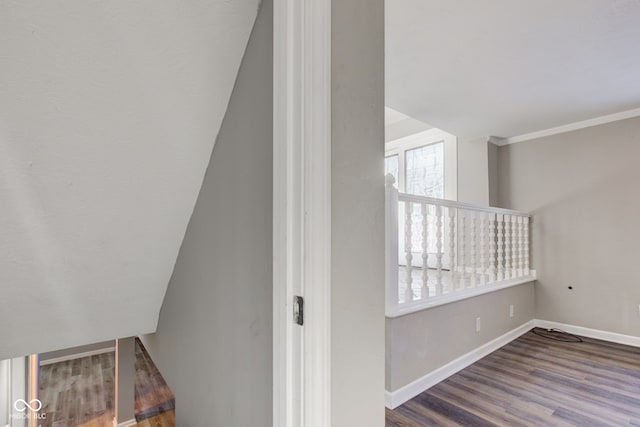 stairway featuring baseboards and wood finished floors