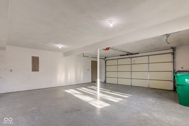 garage featuring a garage door opener and electric panel