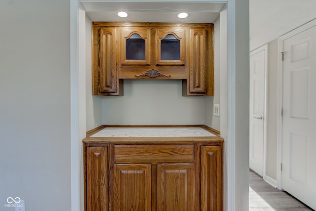 kitchen featuring brown cabinetry and light wood-style floors