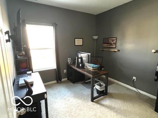 office area with carpet flooring and baseboards