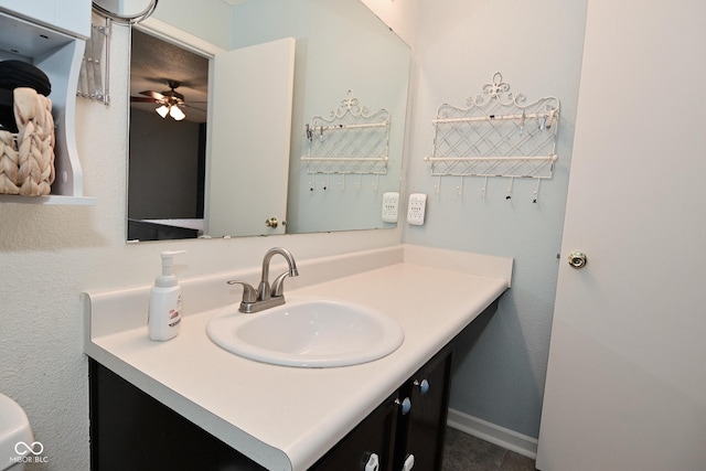 bathroom with baseboards and vanity