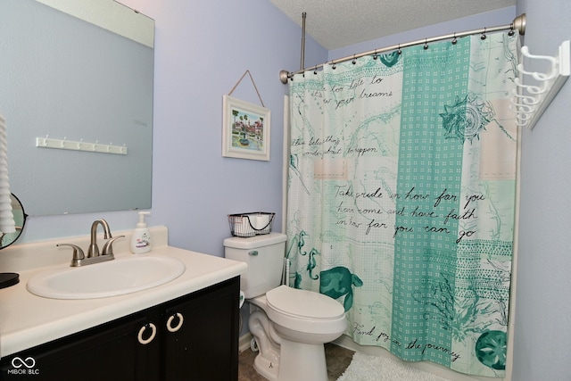 bathroom featuring a shower with curtain, a textured ceiling, toilet, and vanity