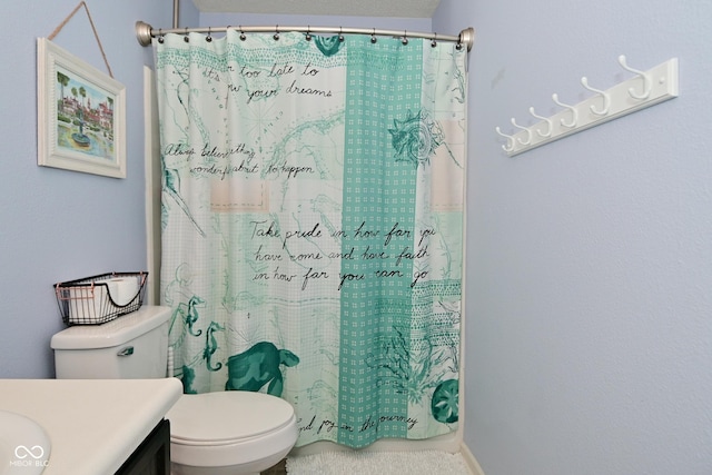 full bathroom with vanity, toilet, and a shower with curtain