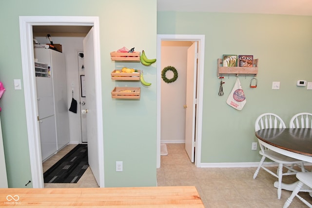 interior space featuring baseboards