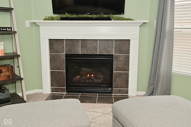 interior details featuring a fireplace and baseboards