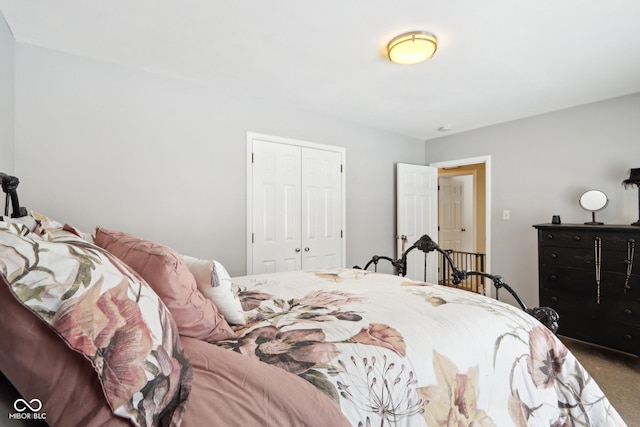 carpeted bedroom featuring a closet