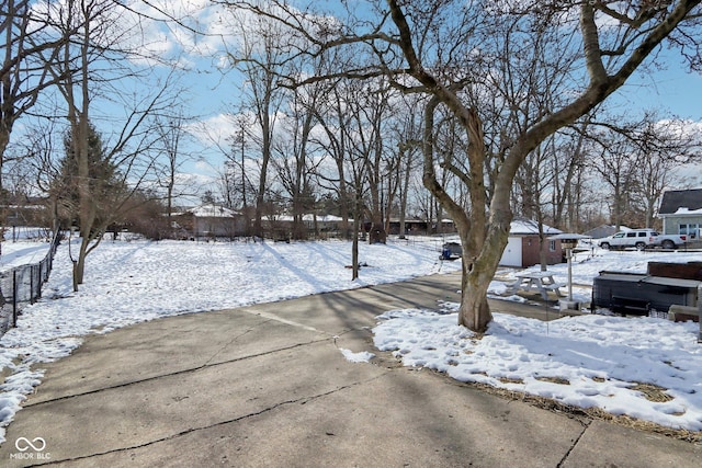 view of yard layered in snow