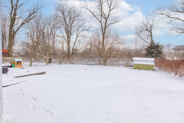 view of yard covered in snow