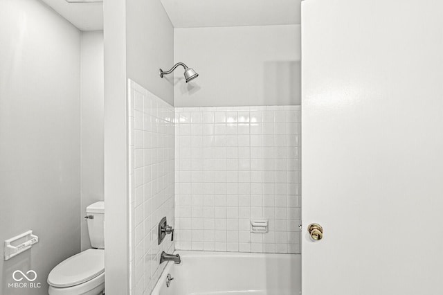 bathroom with tub / shower combination and toilet