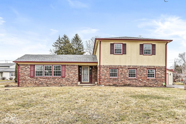 view of front of home featuring brick siding and a front lawn