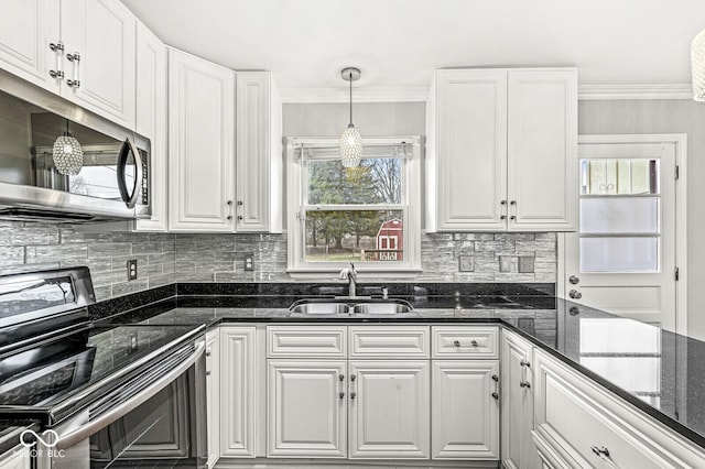 kitchen with crown molding, appliances with stainless steel finishes, white cabinets, and a sink