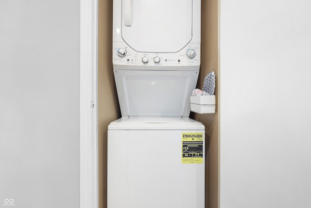 laundry room featuring stacked washer and dryer and laundry area