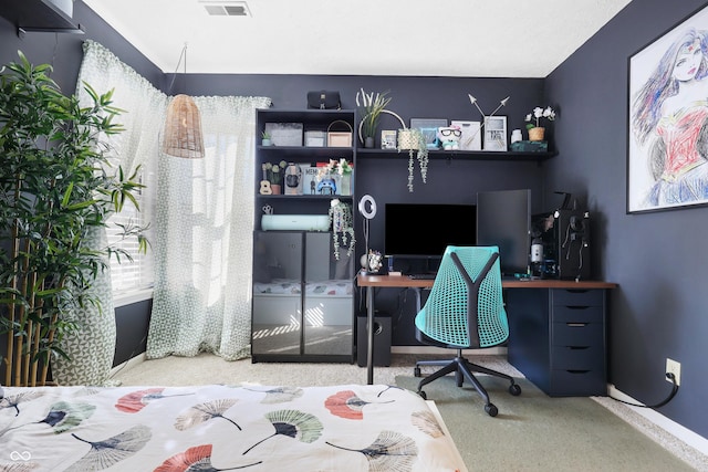 home office featuring carpet, a wealth of natural light, and baseboards