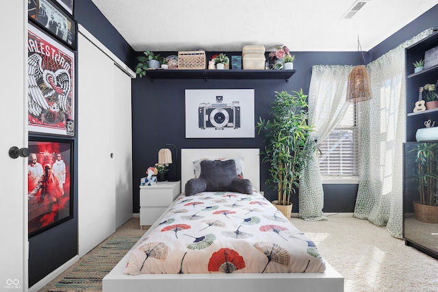 bedroom featuring a closet and visible vents