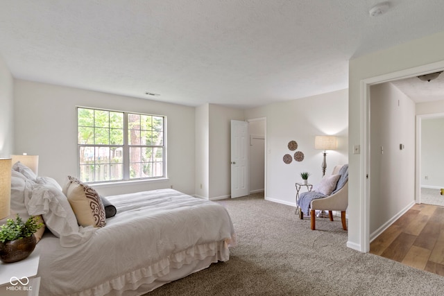 bedroom featuring baseboards and carpet flooring