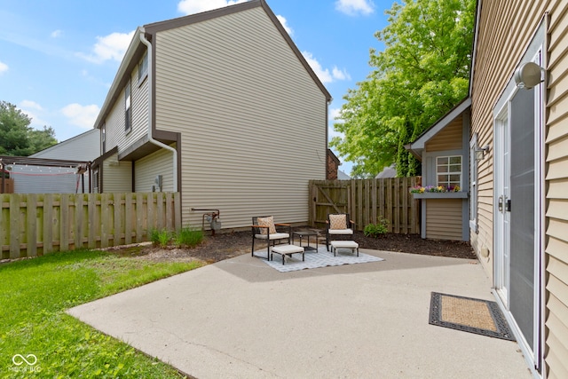 view of patio featuring fence