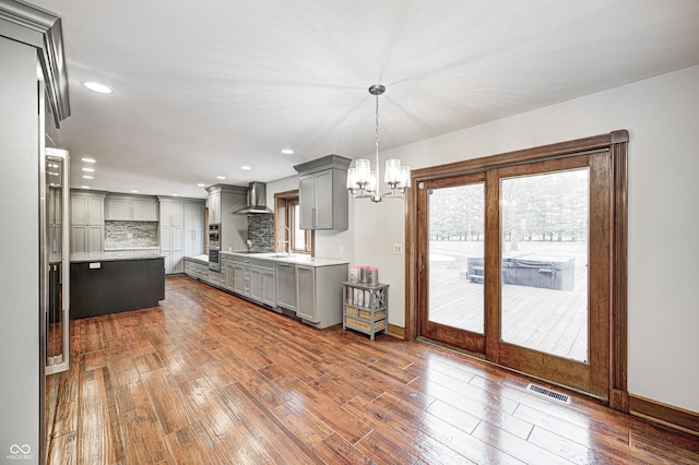 690 N 600 W, Lebanon, IN 46052 - kitchen featuring wall chimney exhaust hood, dark wood-style flooring, gray cabinets, and light countertops