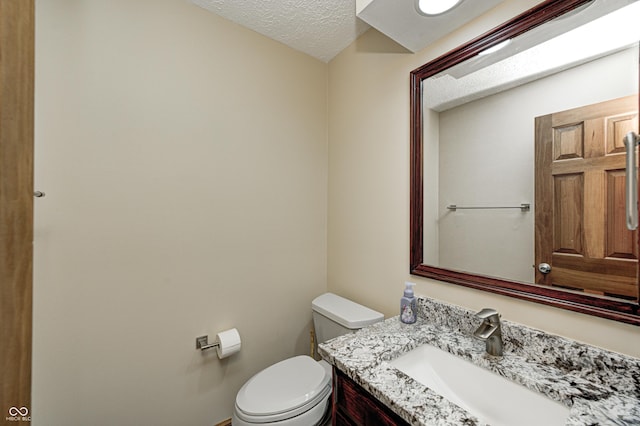 690 N 600 W, Lebanon, IN 46052 - bathroom with a textured ceiling, vanity, and toilet