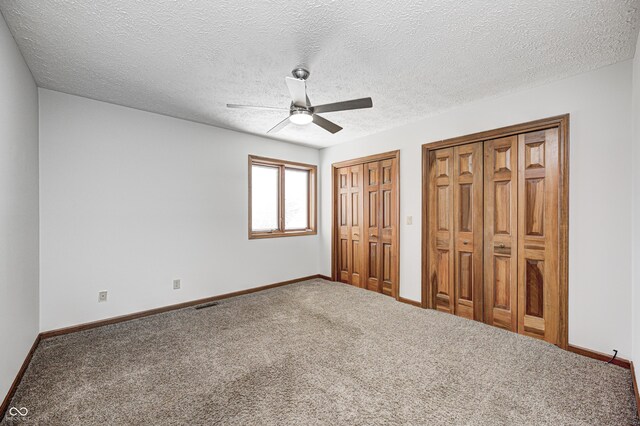 690 N 600 W, Lebanon, IN 46052 - unfurnished bedroom featuring carpet floors, baseboards, visible vents, and two closets