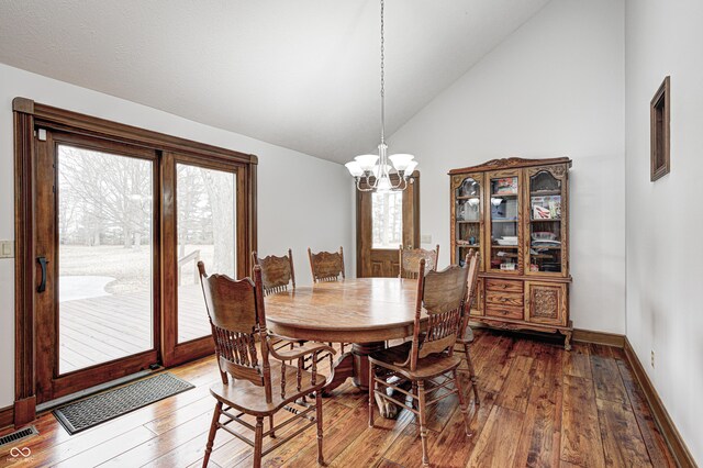690 N 600 W, Lebanon, IN 46052 - dining area with lofted ceiling, a notable chandelier, visible vents, and hardwood / wood-style floors