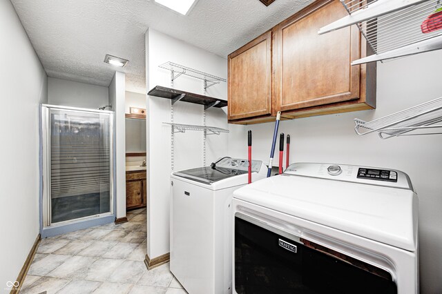 690 N 600 W, Lebanon, IN 46052 - washroom with a textured ceiling, baseboards, cabinet space, and washer and dryer