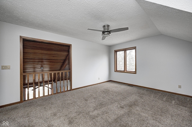 690 N 600 W, Lebanon, IN 46052 - carpeted empty room featuring visible vents, lofted ceiling, a ceiling fan, and baseboards