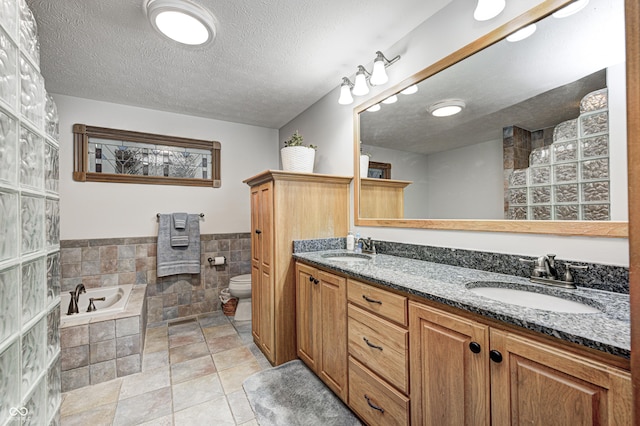 690 N 600 W, Lebanon, IN 46052 - full bathroom featuring a textured ceiling, a sink, toilet, and tile patterned floors