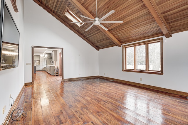 690 N 600 W, Lebanon, IN 46052 - interior space featuring hardwood / wood-style flooring, high vaulted ceiling, beamed ceiling, baseboards, and ceiling fan with notable chandelier