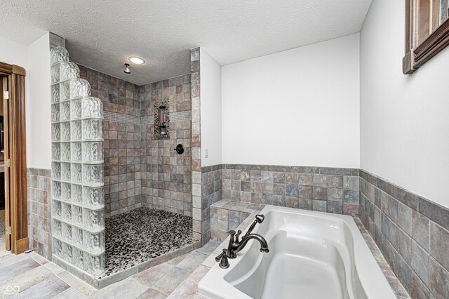 690 N 600 W, Lebanon, IN 46052 - full bath with a textured ceiling, walk in shower, and a bath