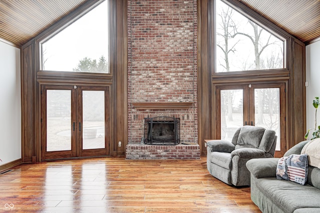 690 N 600 W, Lebanon, IN 46052 - living room featuring light wood-type flooring, high vaulted ceiling, and french doors