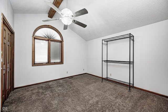 690 N 600 W, Lebanon, IN 46052 - unfurnished bedroom featuring carpet flooring, vaulted ceiling, a textured ceiling, and baseboards