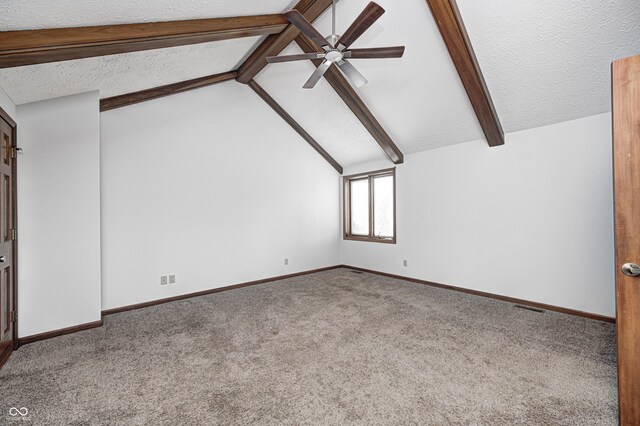 690 N 600 W, Lebanon, IN 46052 - additional living space featuring baseboards, visible vents, vaulted ceiling with beams, a textured ceiling, and carpet flooring
