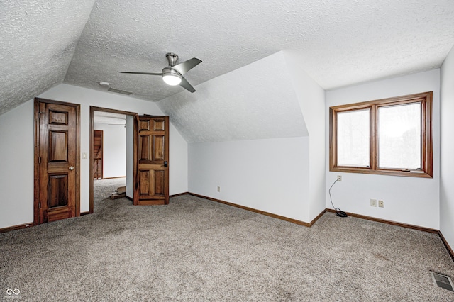 690 N 600 W, Lebanon, IN 46052 - additional living space featuring carpet floors, baseboards, visible vents, and vaulted ceiling