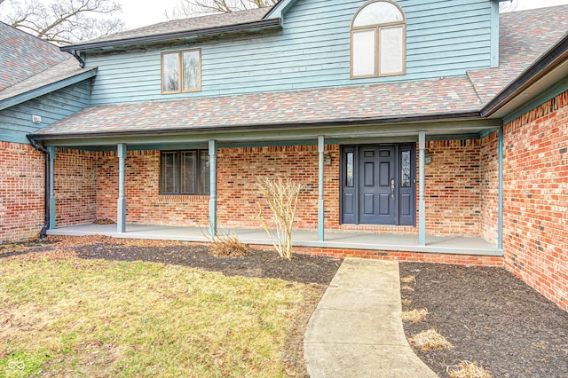 690 N 600 W, Lebanon, IN 46052 - entrance to property with covered porch, brick siding, and a shingled roof
