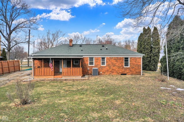 back of property featuring a chimney, a porch, crawl space, central AC, and fence