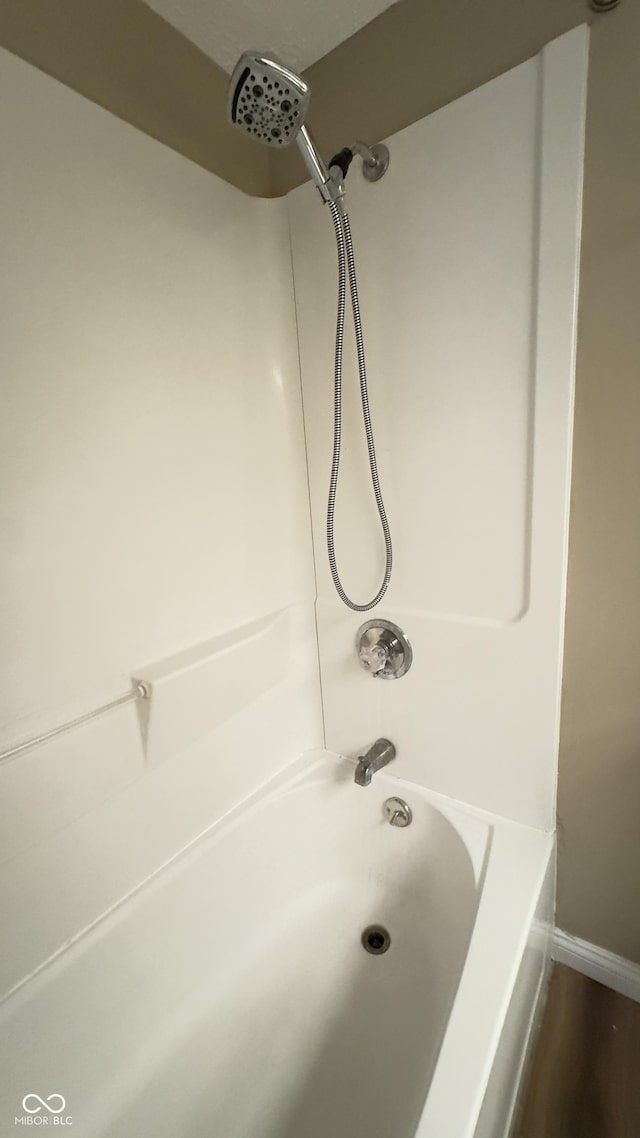 bathroom with shower / bath combination