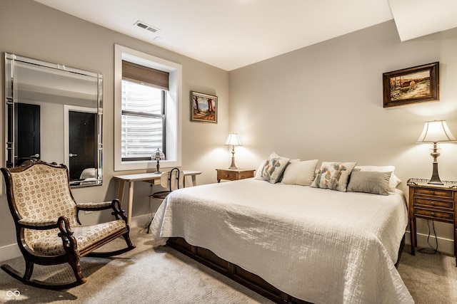 bedroom featuring carpet floors and visible vents