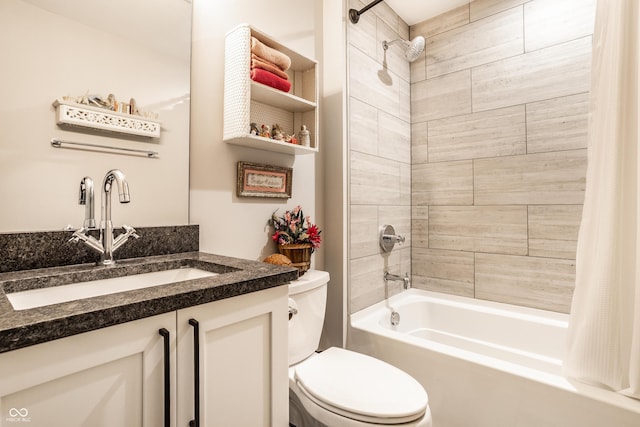 bathroom featuring toilet, shower / tub combo, and vanity